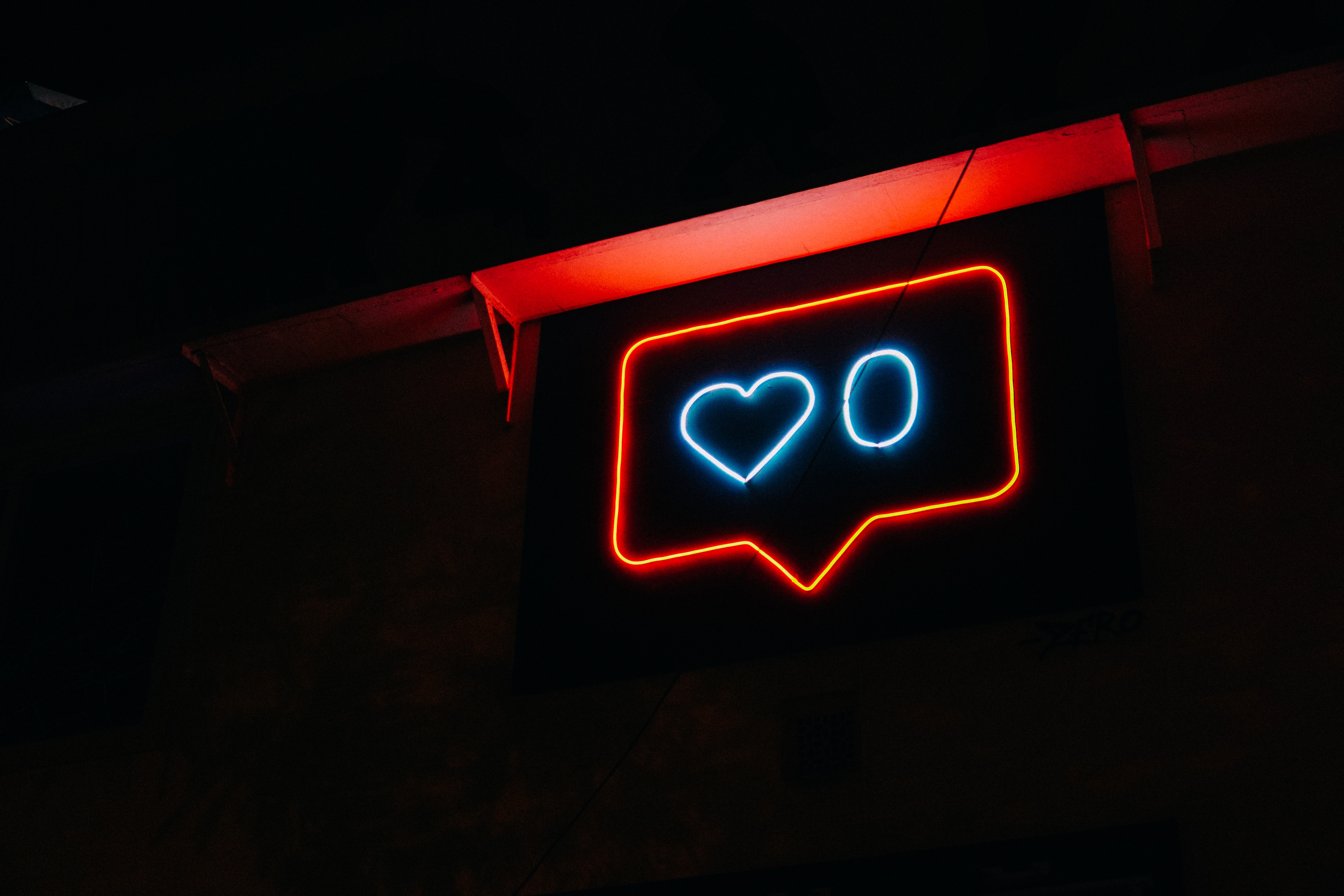  A neon sign showing a like count similar to social media platforms