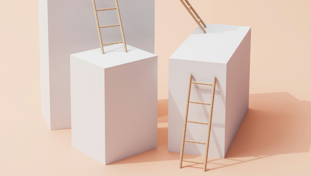 Photo of wooden ladders connecting from the ground to white 3D shapes.