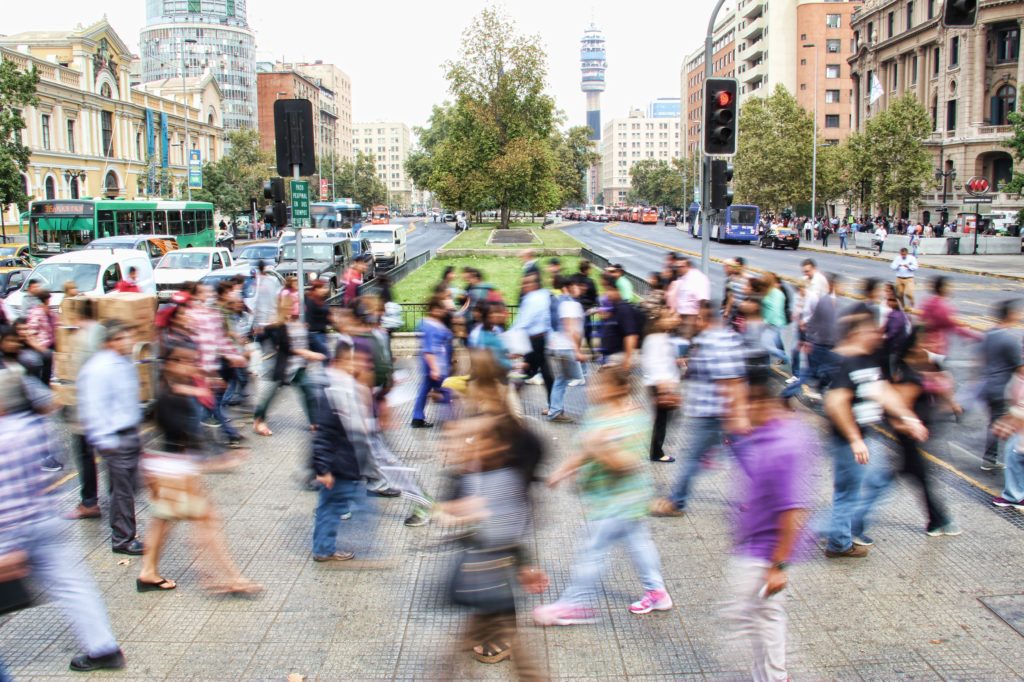 People crossing a city street.