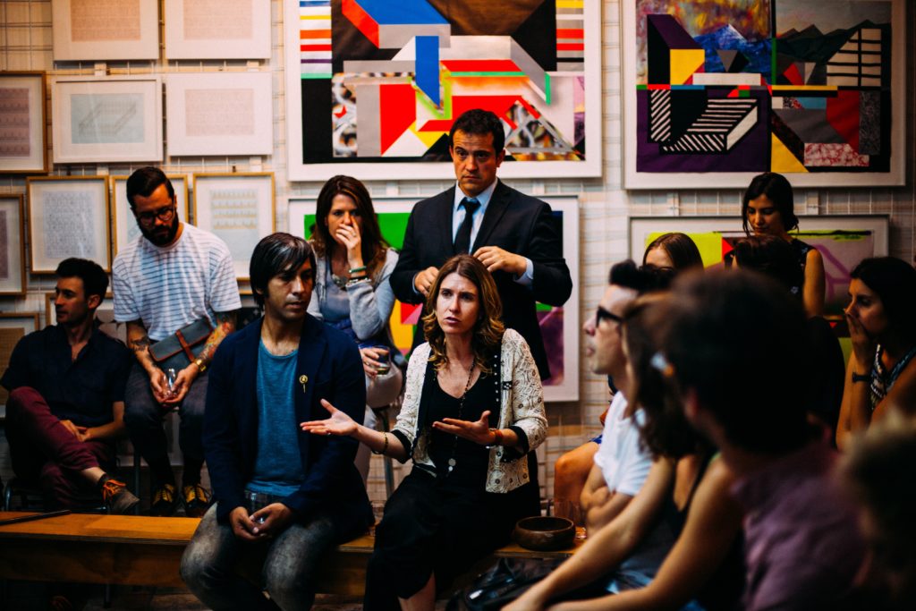 Group of people discussing an issue in a meeting.