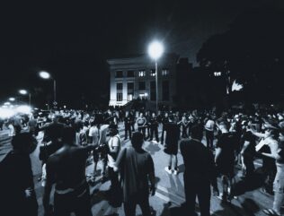 Greyscale image of protesters.