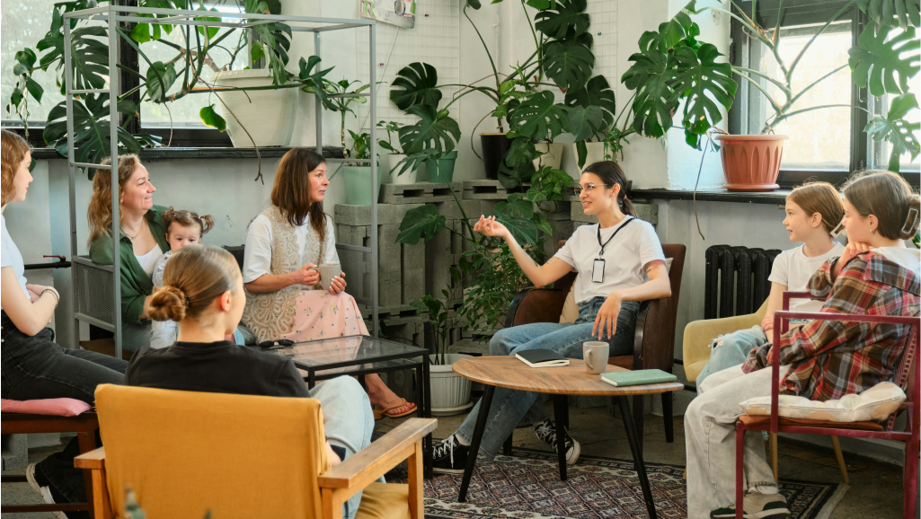 People in discussion in a cafe.