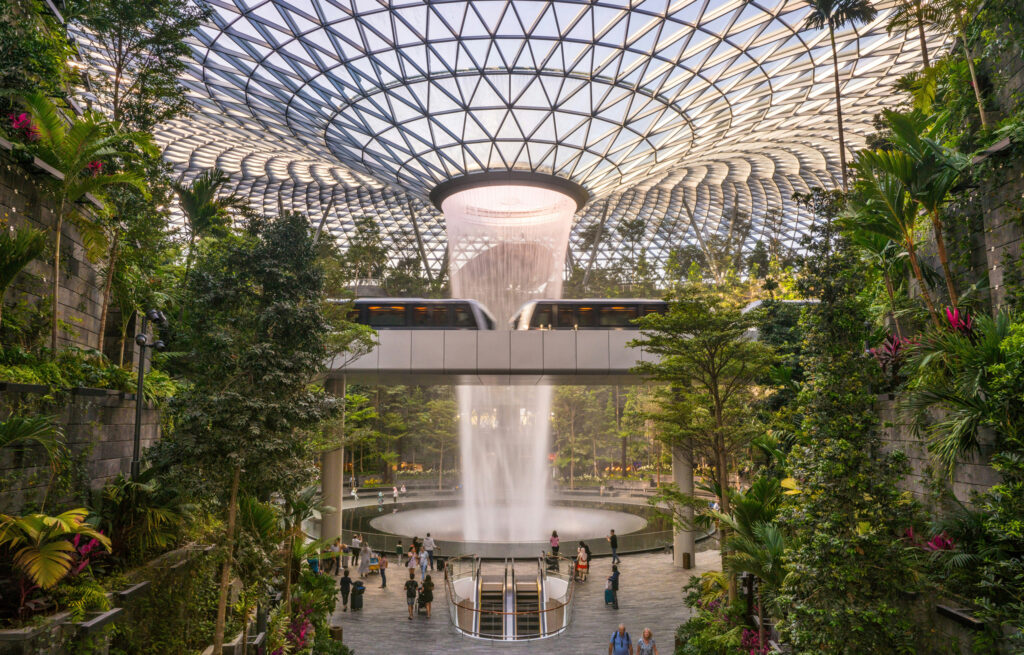 hangi Airport in Singapore with indoor waterfall and living walls.
