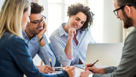 Image of people in a work environment having a meeting - to represent stakeholder meetings.