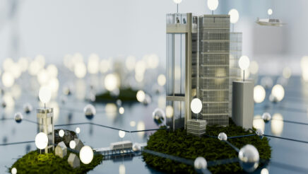 Models of corporate buildings surrounded by light bulbs to represent CSRD reporting and stakeholders.