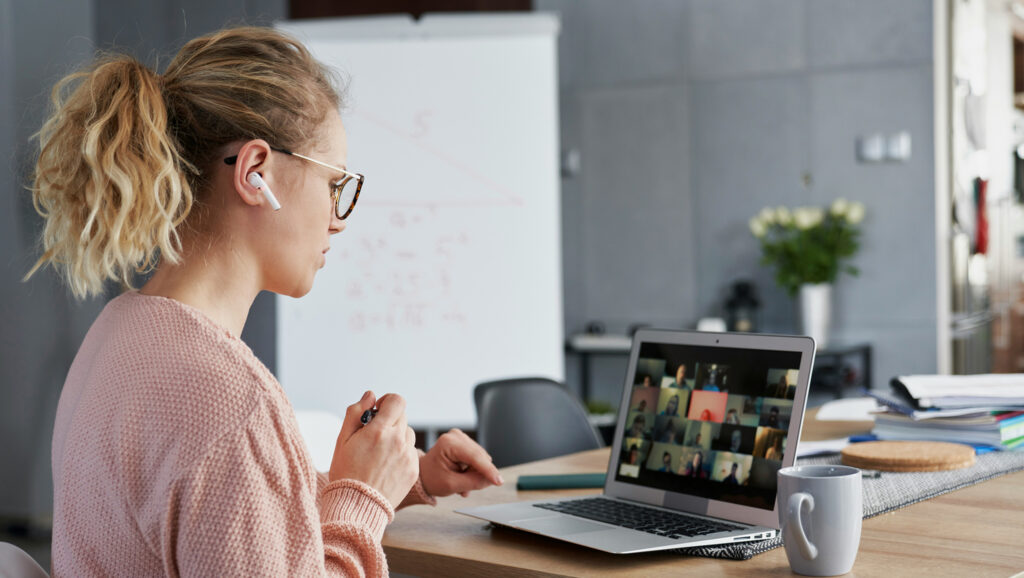 A woman working from home to represent the need for work flexibility. 