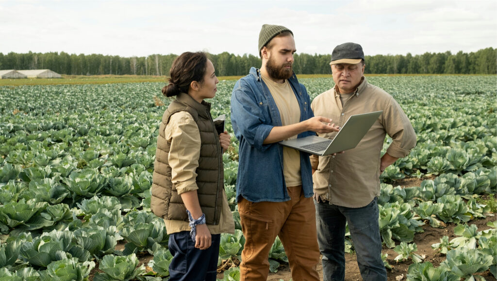 Agile stakeholder engagement means meeting people where they are. Photo of rural workers in a field.