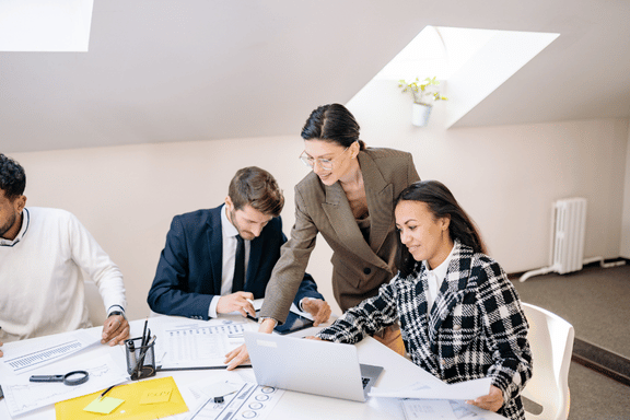Image of people working together on reports